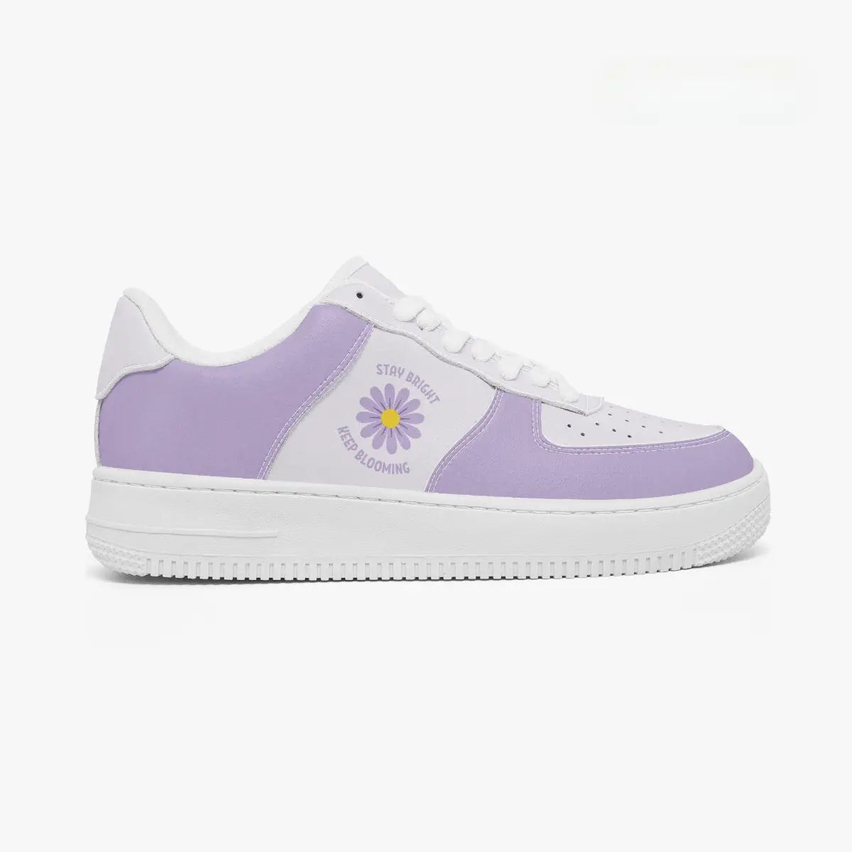 A low-top sneaker in lavender purple and white, featuring a daisy graphic with the text 'STAY BRIGHT KEEP BLOOMING' on the side, set against a plain white background.