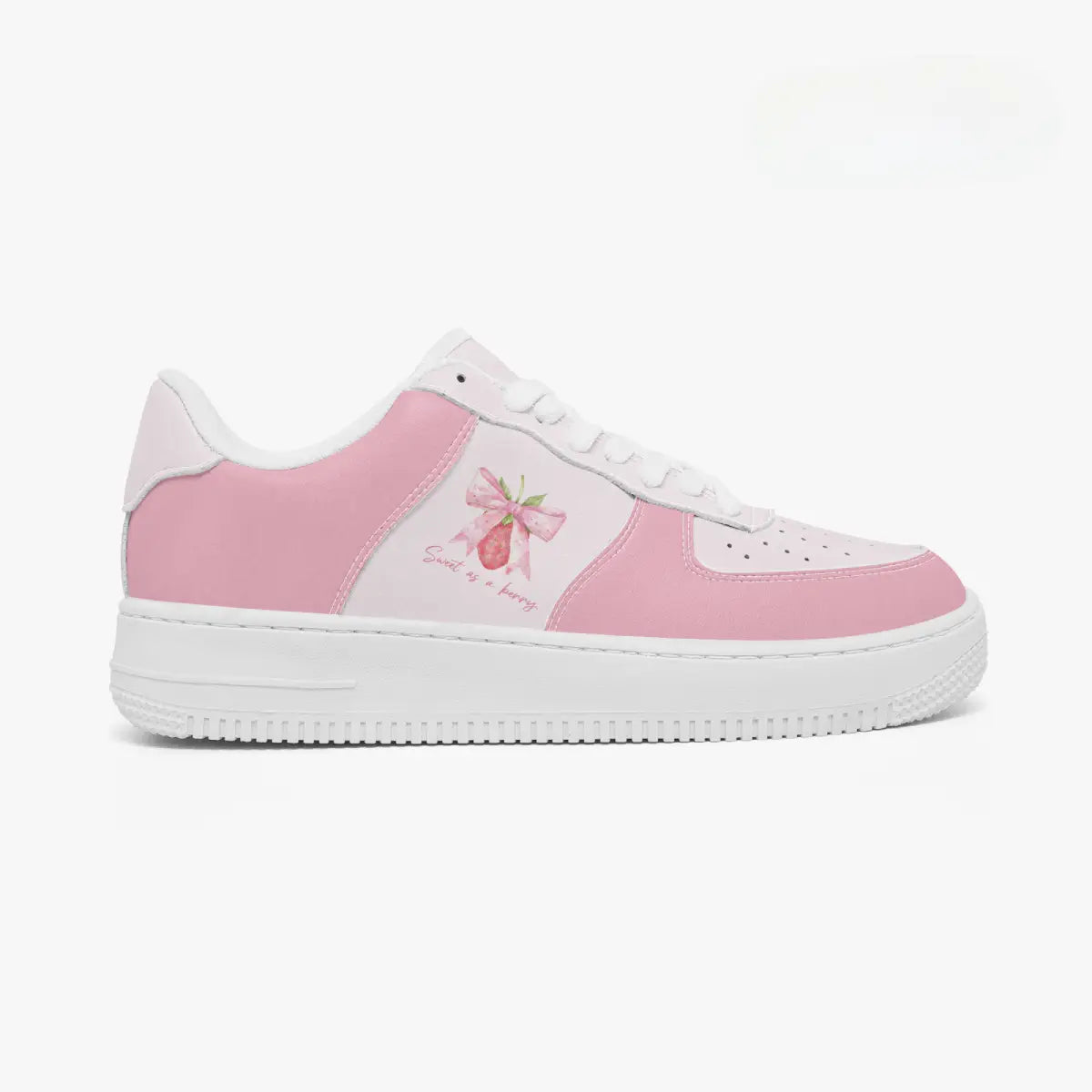 Outer side view of the right shoe in pink and soft white, highlighting the coquette strawberry ribbon design and clean white midsole facing right.
