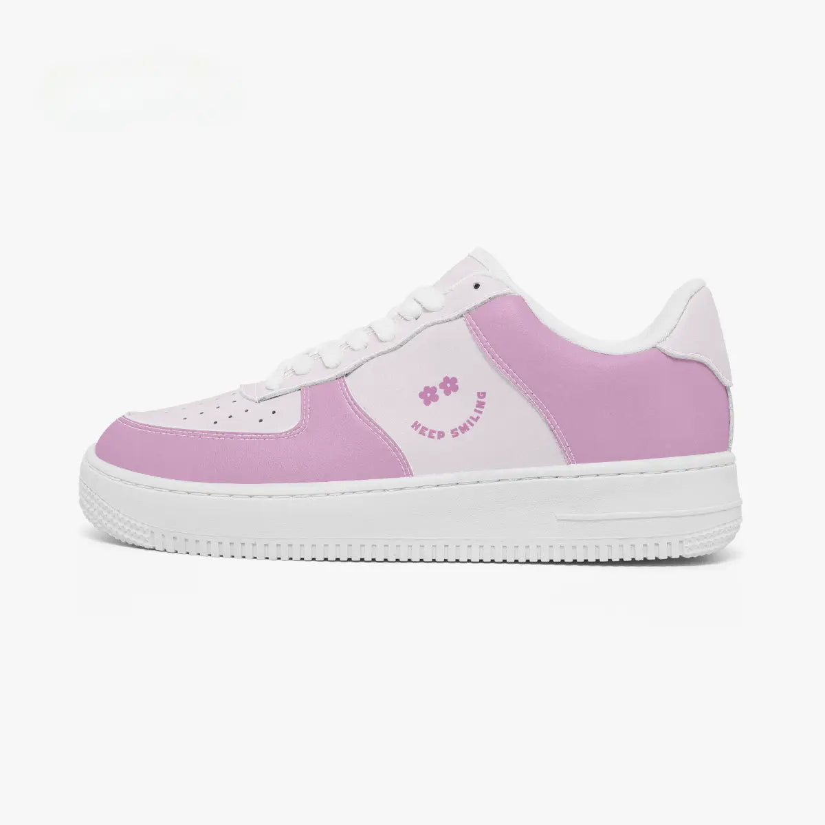 A low-top sneaker in pastel pink and white, featuring a pink side panel with a small pink floral graphic and the text 'KEEP SMILE.' on a clean white background.