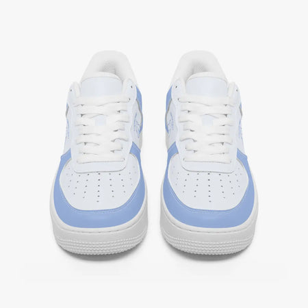 Front view of a pair of white and light periwinkle blue low-top sneakers with white laces and perforated toe caps on a clean white background.