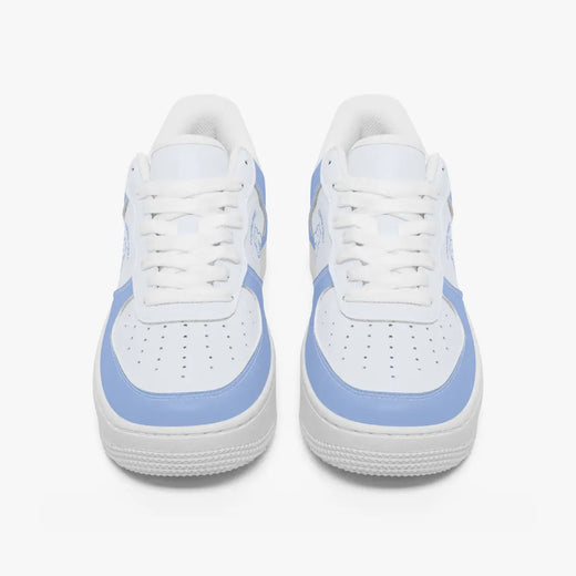 Front view of a pair of white and light periwinkle blue low-top sneakers with white laces and perforated toe caps on a clean white background.