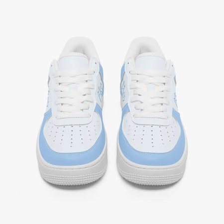 Front view of a pair of low-top sneakers in white and pastel blue leather with white laces and perforated toe caps.