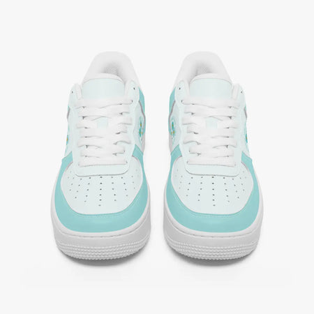 Front view of a pair of white and mint green low-top sneakers with white laces and perforated toe caps on a plain background.