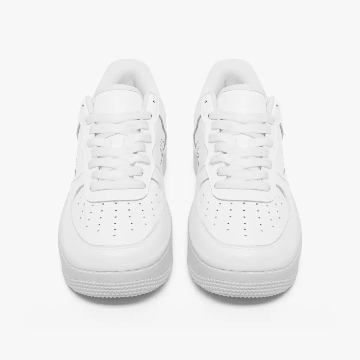 A pair of low-top white sneakers shown from a front-facing overhead angle on a clean white background.