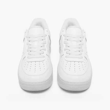 A pair of low-top white sneakers shown from a front-facing overhead angle on a clean white background.