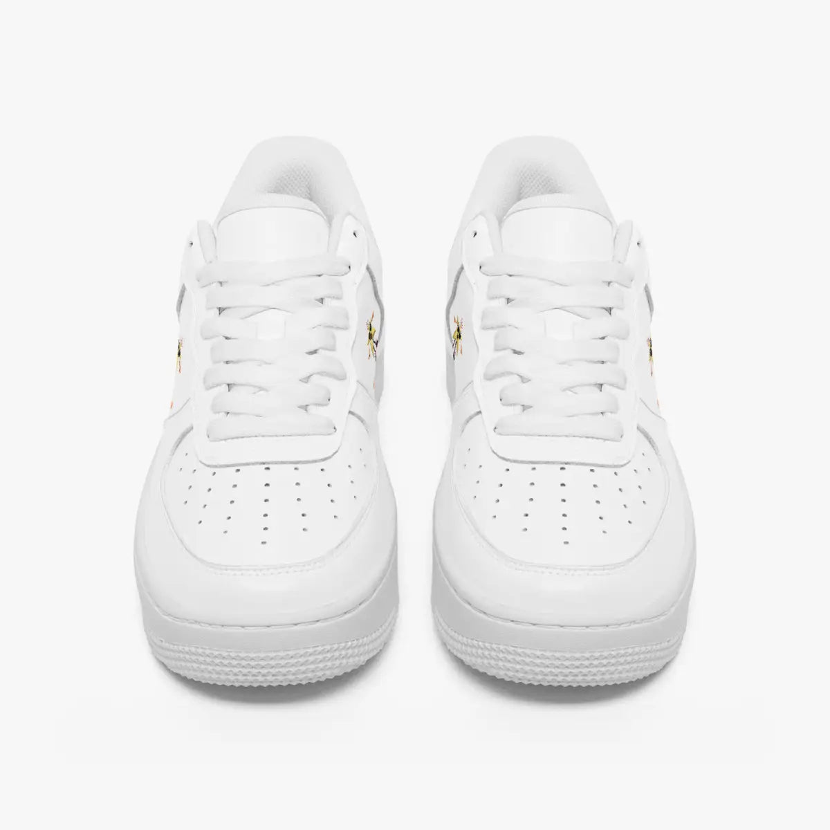Front view of a pair of minimalist white low-top leather sneakers with matching laces and perforated toe caps on a plain background.