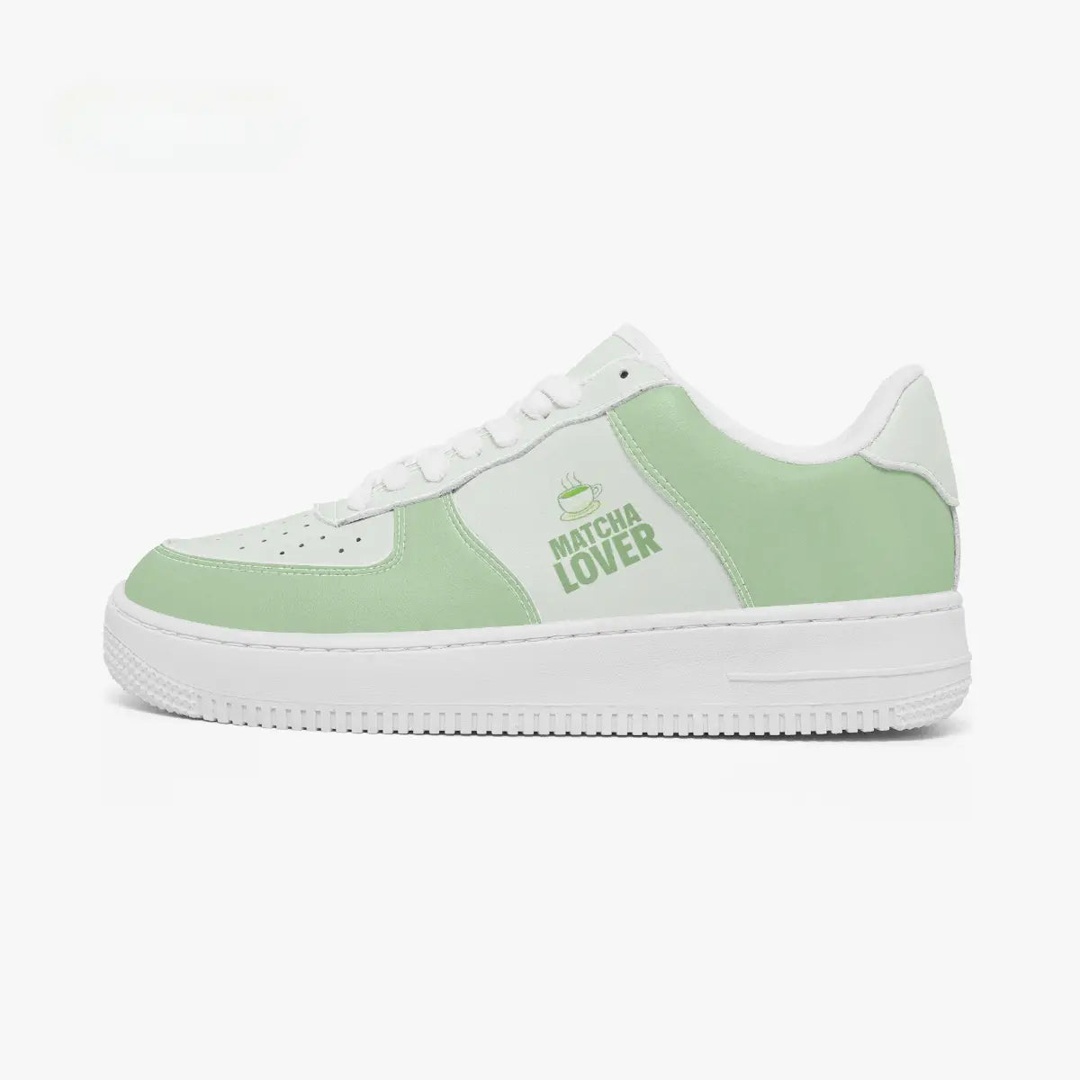 Outer side view of the left shoe featuring matcha green overlays, white side panels, and a textured white outsole facing left.
