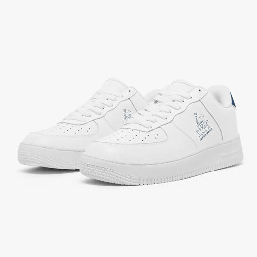 Angled three-quarter view of white sneakers featuring a line-art tugboat graphic and "CALM SEAS, SIMPLE LIFE" printed on the side panel.