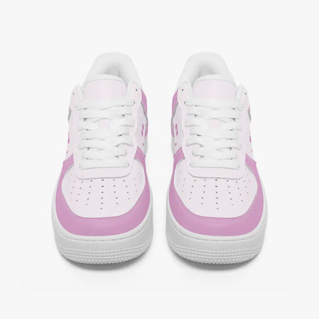 A pair of white low-top sneakers with light pink side panels and matching pink accents on the toe and heel, shown from a front-facing perspective on a clean white background.
