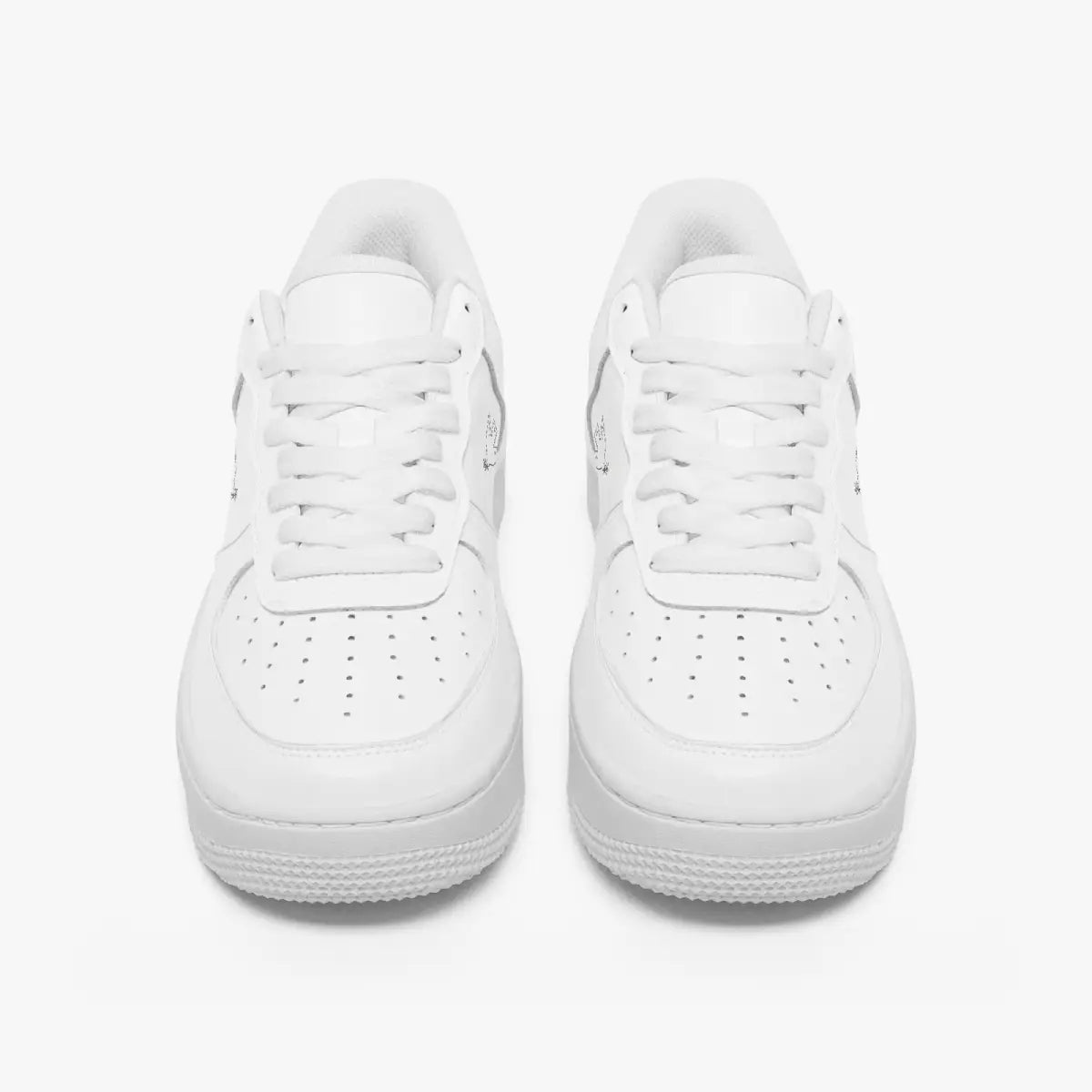 Front view of a pair of minimalist all-white low-top leather sneakers with white laces and perforated toe caps on a clean white background.