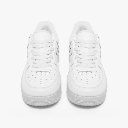 Front view of a pair of minimalist all-white low-top leather sneakers with white laces and perforated toe caps on a clean white background.