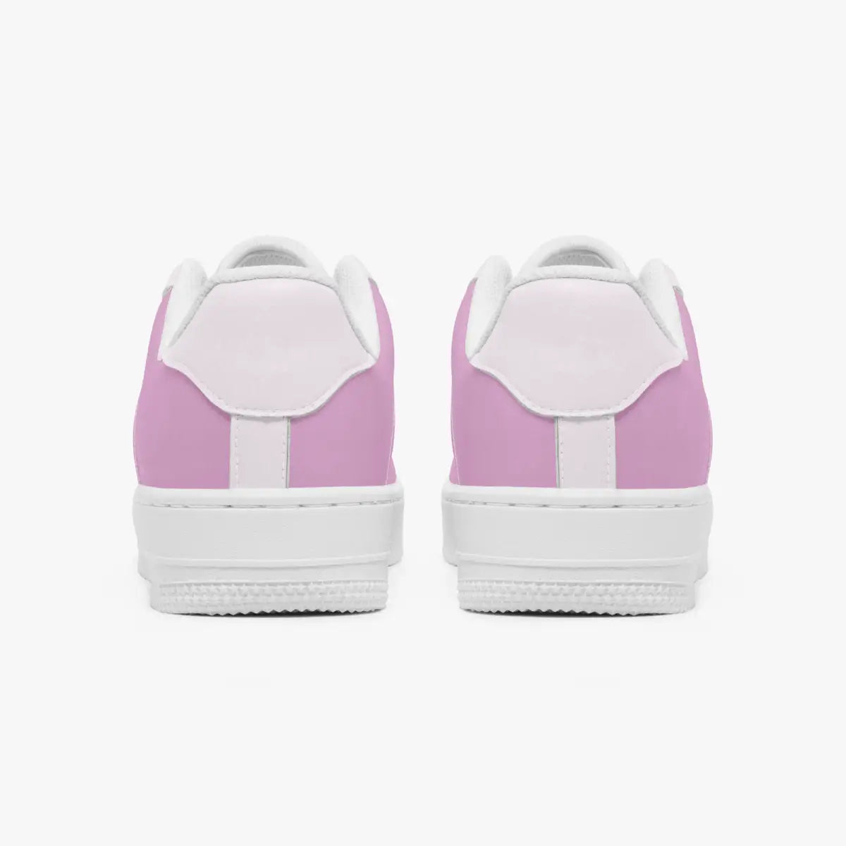 A pair of low-top sneakers shown from the back, featuring a light pink canvas upper with white laces, white midsoles, and white rubber soles, set against a plain light gray background.