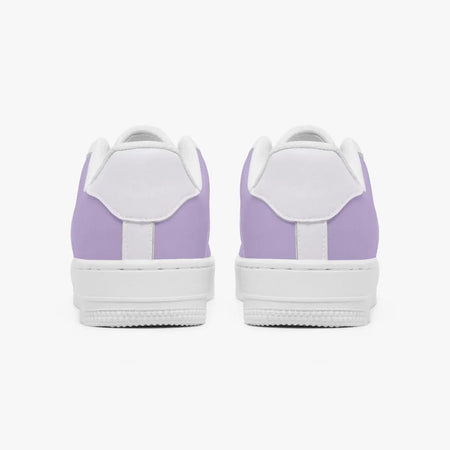 A pair of low-top sneakers shown from the back, featuring light purple panels and white overlays, set against a clean white background.