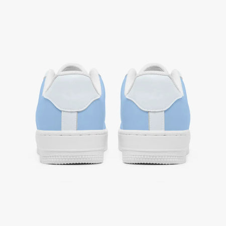 Rear view of a pair of light blue and white low-top sneakers displaying the heel tabs and white textured soles.