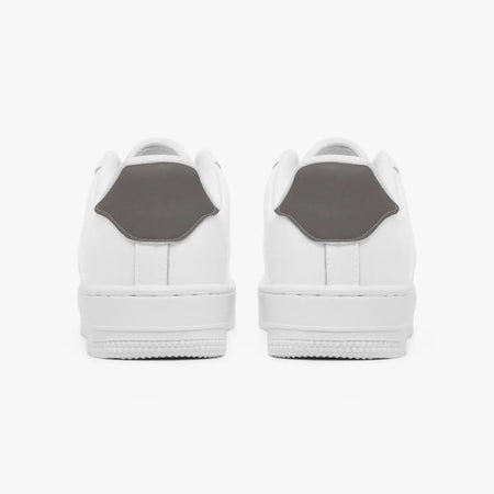 A pair of white low-top sneakers shown from the back, featuring a contrasting dark gray heel tab, set against a clean white background.