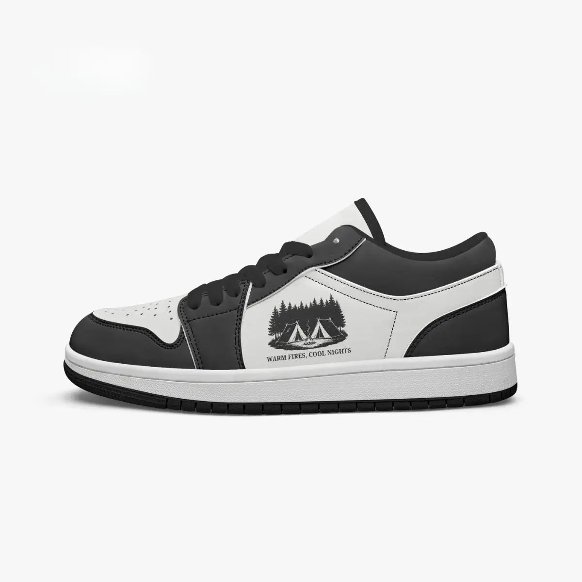 Side profile view of the right low-top sneaker in charcoal black and white leather, featuring a camping tents graphic with "WARM FIRES, COOL NIGHTS", black laces, and a black inner lining facing right.