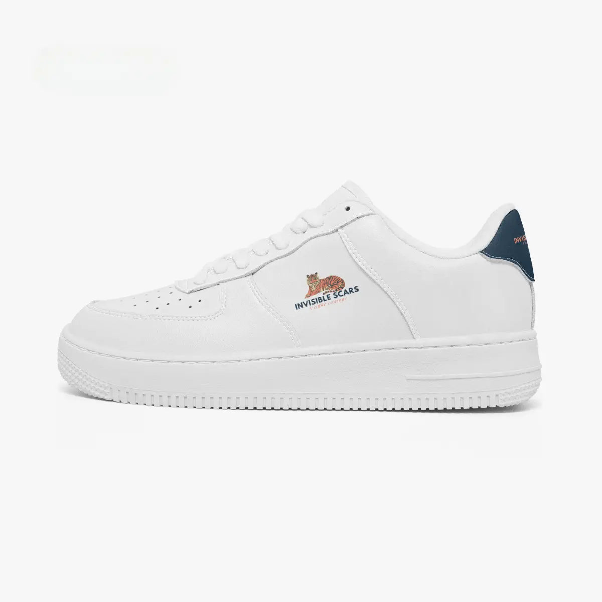 A white low-top sneaker with a navy blue heel tab, featuring the 'INVINCIBLE SCARS' logo in orange and blue on the side and a small orange cat graphic above it.