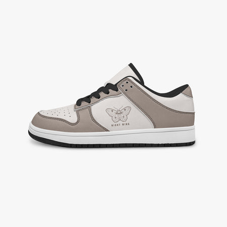 Side profile view of the left sneaker highlighting the taupe leather panels, moth graphic with "NIGHT WING", black interior lining, and flat rubber sole facing right.