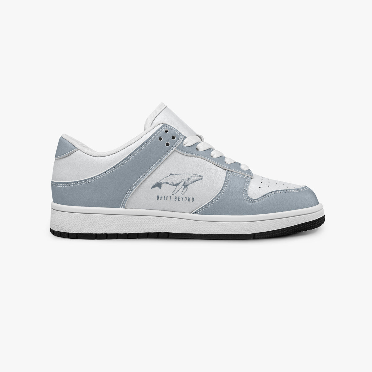 Side profile view of the right sneaker in slate blue-grey and white leather, showcasing the whale graphic with "DRIFT BEYOND", white laces, and a flat rubber sole facing right.