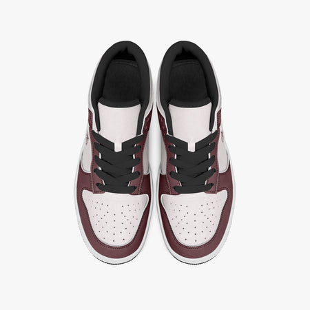 Overhead view of burgundy and pale pink sneakers displaying black laces, black padded collar lining, and perforated pale pink leather toe boxes.