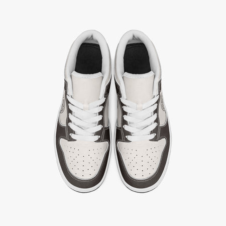 Overhead view of dark brown and cream sneakers showing clean white laces, white padded collar lining, and perforated cream leather toe boxes.