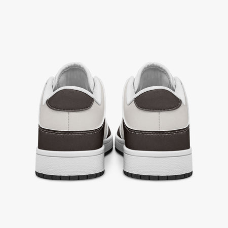 Rear view of dark brown and off-white sneakers displaying espresso brown heel overlays, off-white leather collar panels, and two-tone white and black rubber outsoles.