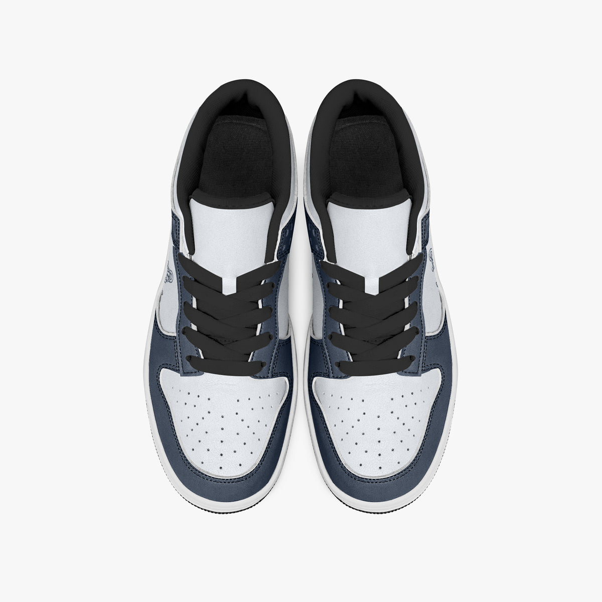 Overhead view of navy blue and white sneakers showing black laces, black padded inner collars, and perforated white leather toe boxes.