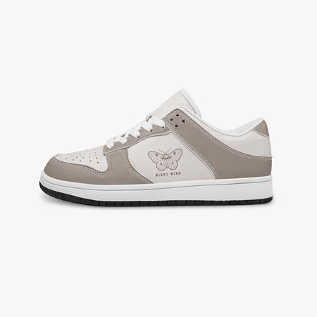 Side profile view of the left sneaker in taupe and off-white leather, highlighting the "NIGHT WING" moth design, white laces, white interior lining, and flat rubber sole facing right.