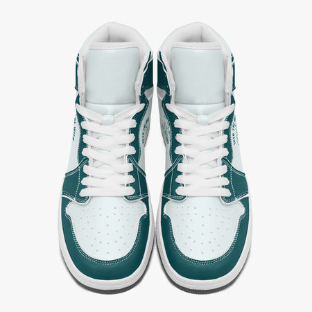 Overhead view of dark teal and white high-top sneakers showing clean white laces, white padded collar lining, and perforated white leather toe boxes.