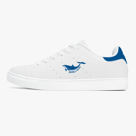 A white low-top sneaker with a blue whale graphic and 'Diving Sharks' text on the side, shown from a profile view against a light gray background.