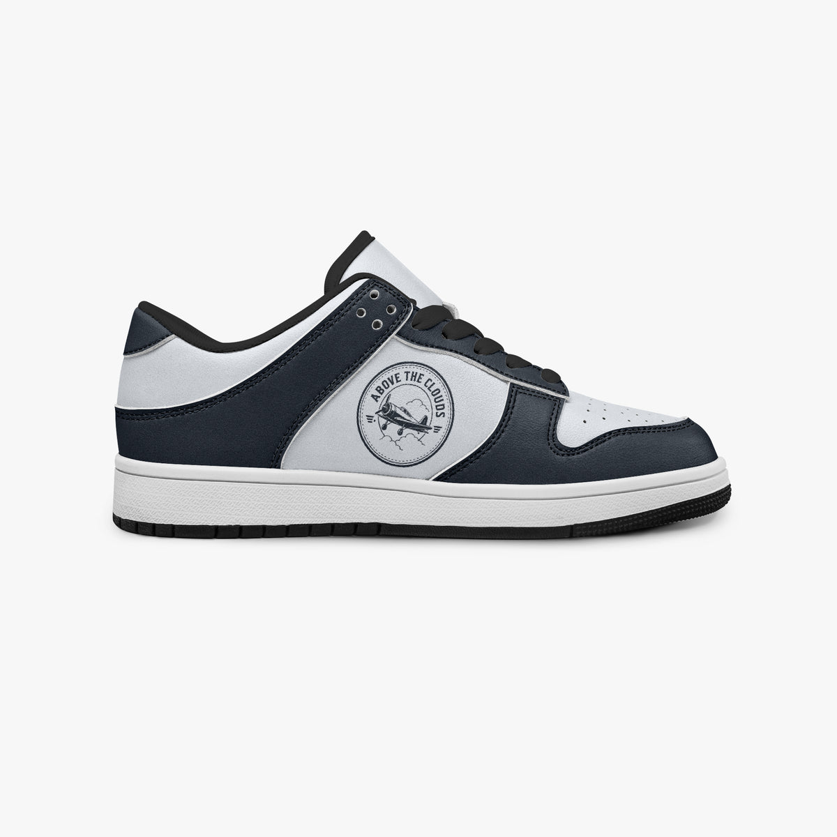 Side profile view of the right sneaker showcasing the navy and off-white color blocking, "ABOVE THE CLOUDS" airplane emblem, black laces, and black rubber outsole facing right.