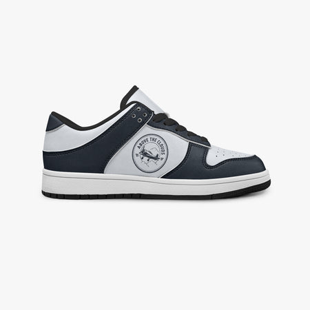 Side profile view of the right sneaker showcasing the navy and off-white color blocking, "ABOVE THE CLOUDS" airplane emblem, black laces, and black rubber outsole facing right.
