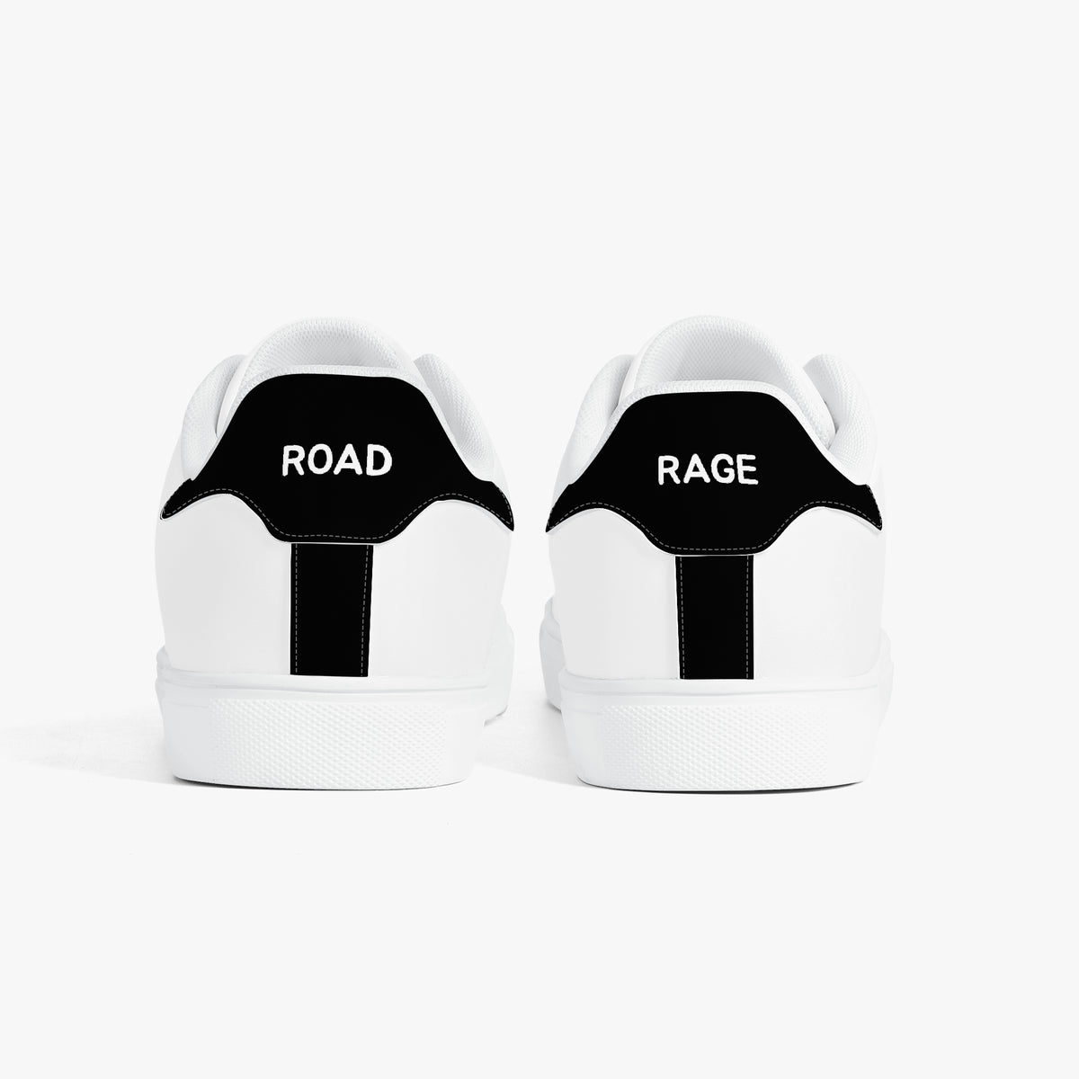 White sneakers with green accents and turtle design on a white background