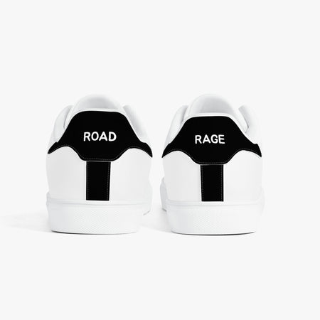 White sneakers with green accents and turtle design on a white background