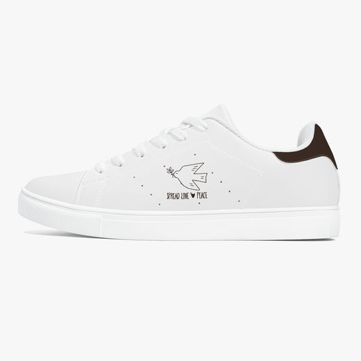 A white low-top sneaker with a dark brown heel tab, featuring a printed dove and the words 'SPREAD LOVE • FEAR' on the side, shown against a plain white background.