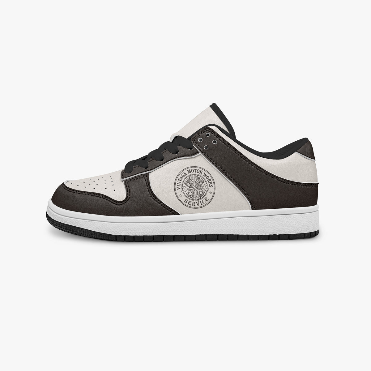 Side profile view of the left sneaker highlighting the dark brown leather panels, motor service emblem, black interior lining, and flat rubber sole facing right.