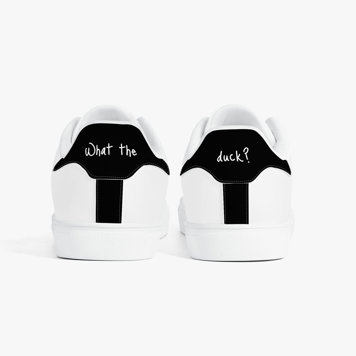 White sneakers with 'Emotionally tired.' text on a white background
