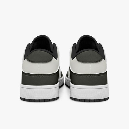 Rear view of olive-grey and off-white sneakers showing dark heel overlays, off-white leather collar panels, and black interior collar lining above white midsoles.
