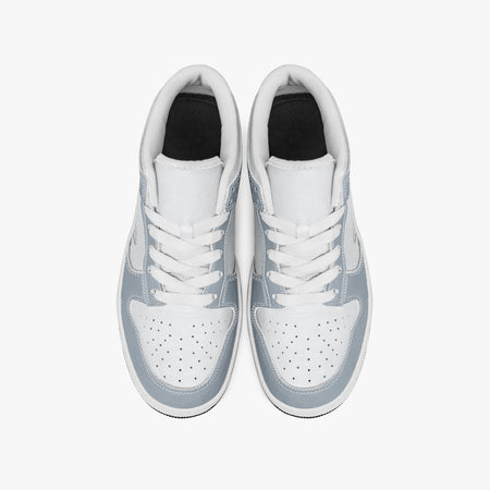Overhead view of slate blue-grey and white sneakers showing clean white laces, white padded collar lining, and perforated white leather toe boxes.