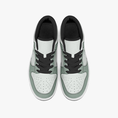 Overhead view of sage green and off-white sneakers displaying black laces, black padded collar lining, and perforated off-white leather toe boxes.