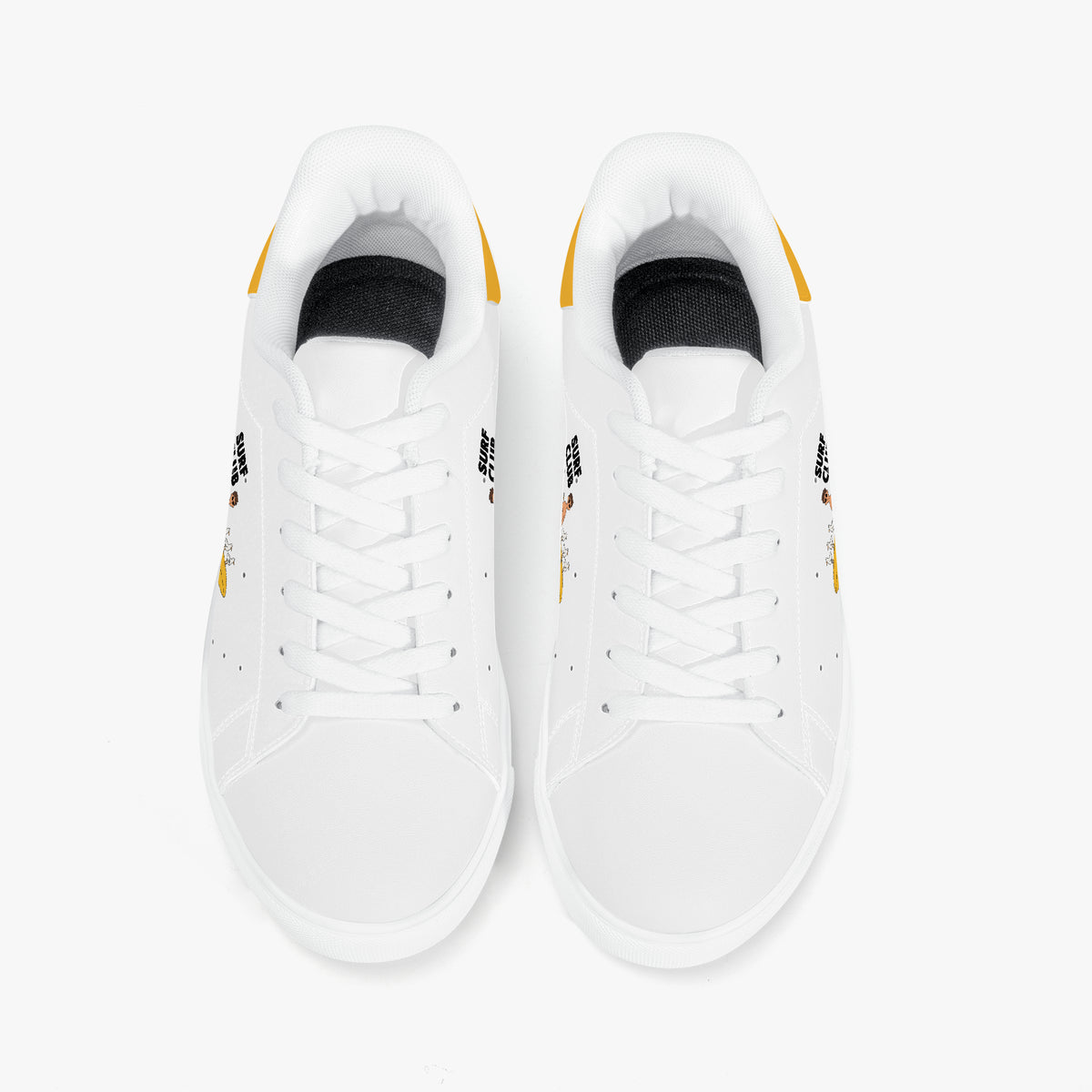 A pair of white low-top sneakers shown from a top-down view on a clean white background. The shoes feature white laces, a black interior lining, and small yellow and black graphic accents on the sides and heel.