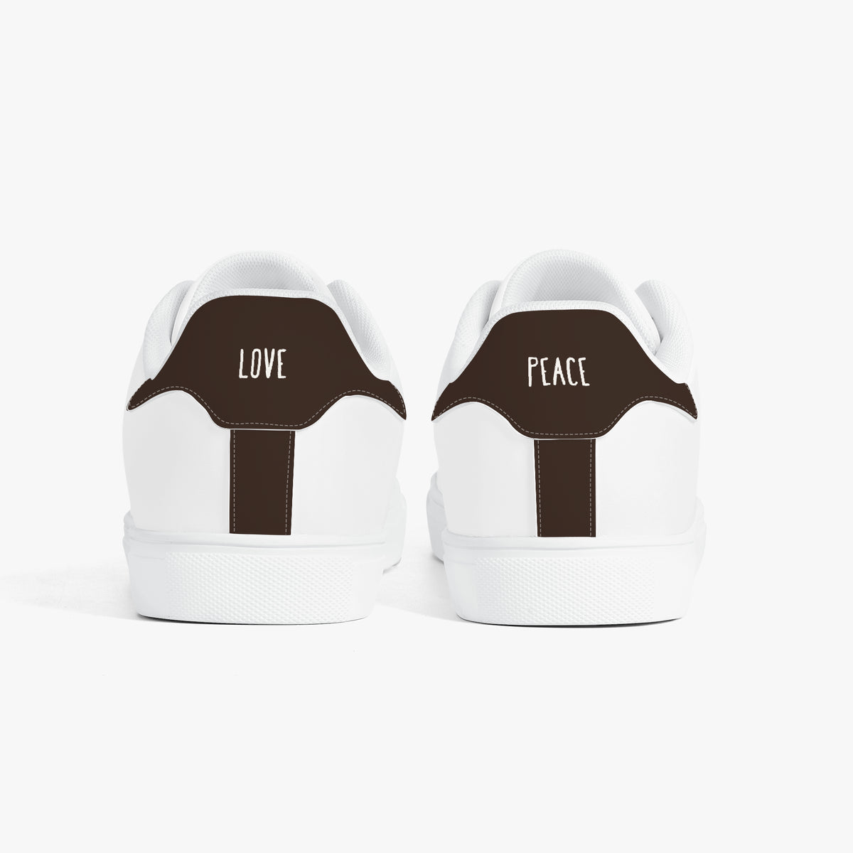White sneakers with brown accents on a white background
