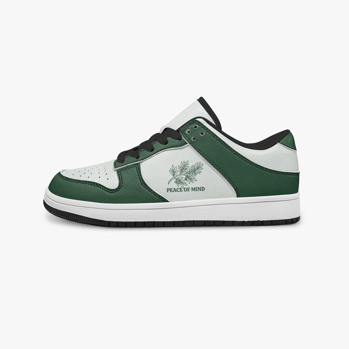 Side profile view of the left sneaker highlighting the green leather panels, botanical emblem, black interior lining, and flat rubber sole facing right.