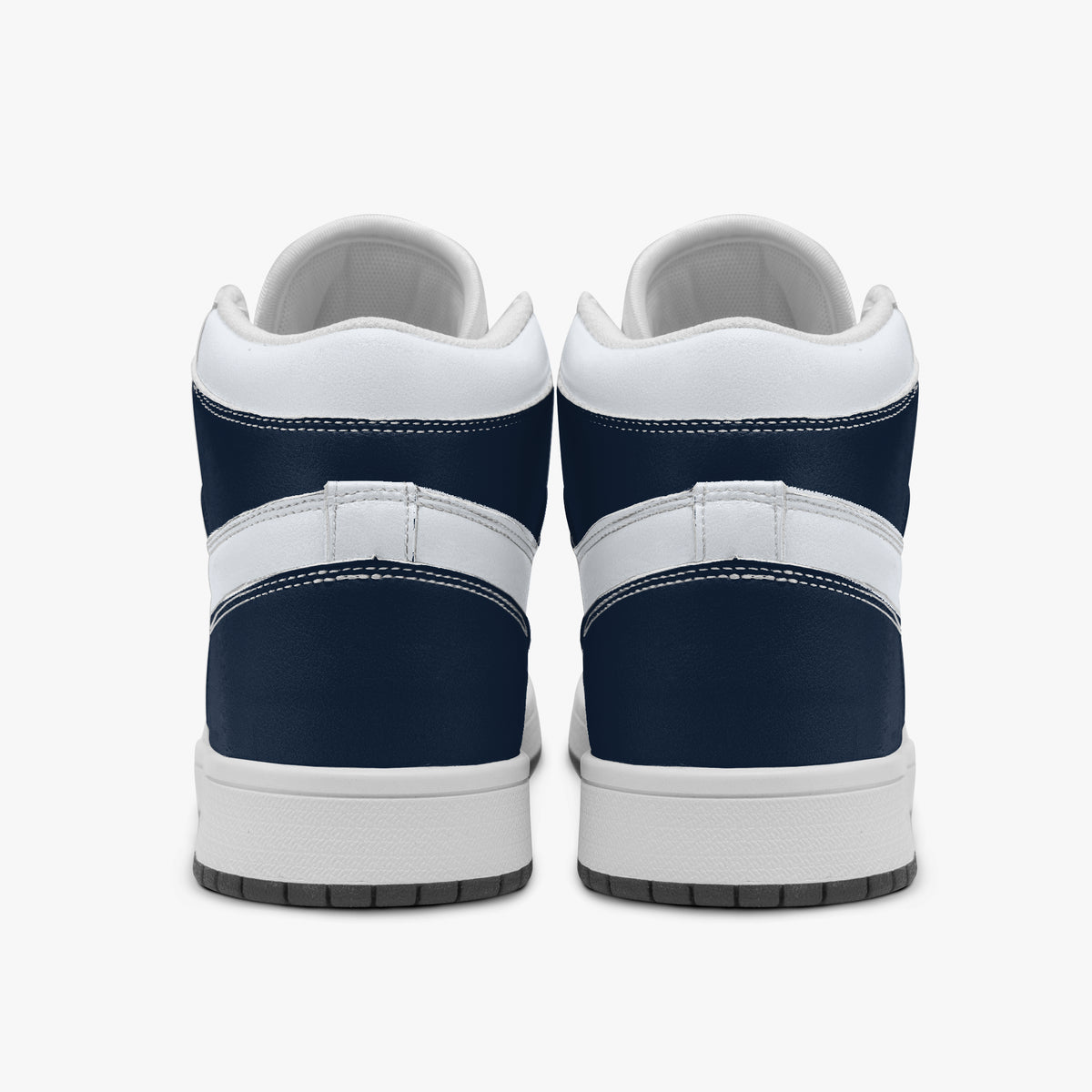 Centered rear view of high-top sneakers showing dark navy leather heel wraps, white padded upper collars, and clean white midsoles.